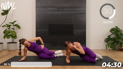 two women performing a side plank lift off as part of the best pelvic floor exercises