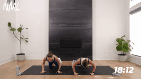 two women performing push ups