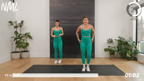 2 women performing squat and him abductions as part of pre running stretches