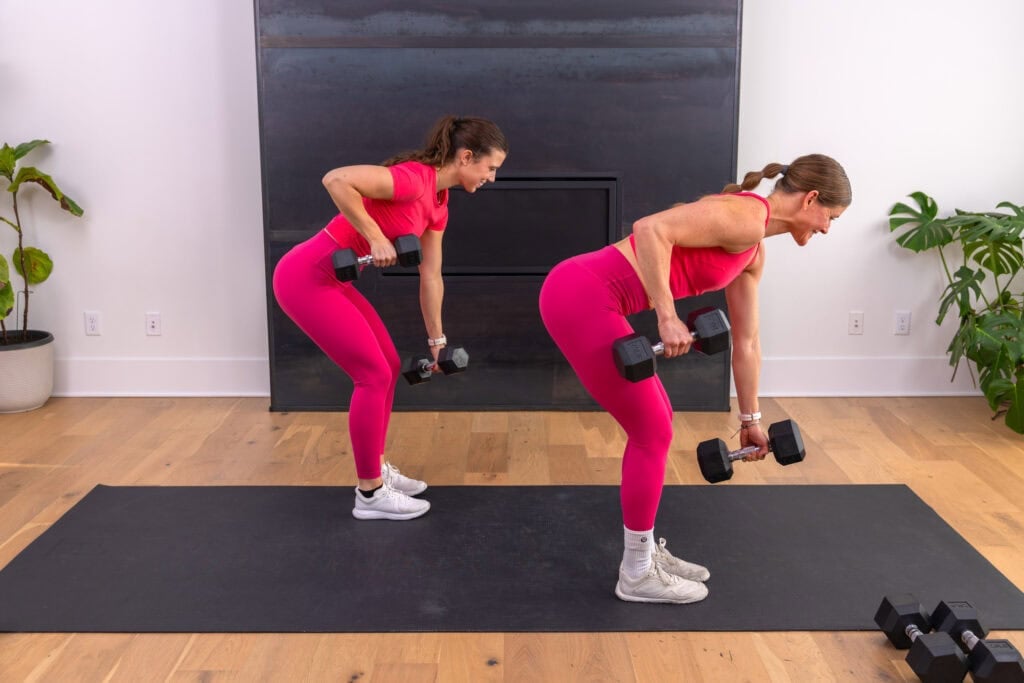 two women performing a single arm back row in a full body workout for women