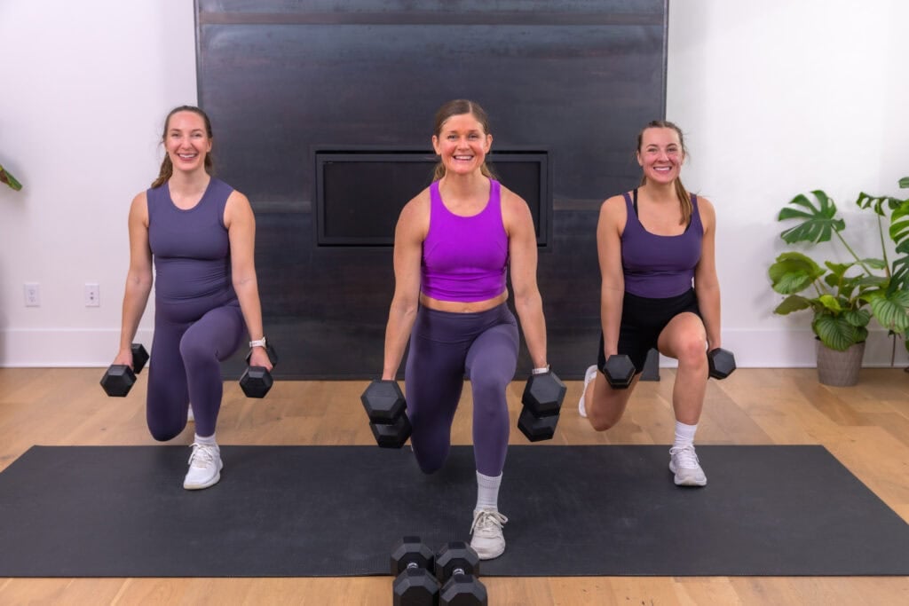 three women performing a reverse lunge in an at home full body workout