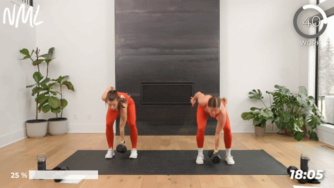 Two women doing a dumbbell snatch into three overload marches.