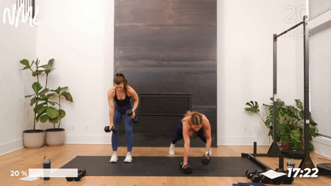 One women performing plank and rows, one women performing narrow back rows.