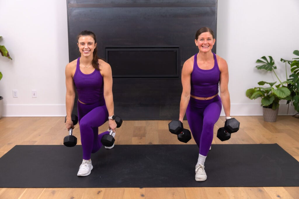 2 women performing a curtsy lunge as part of full body home workout