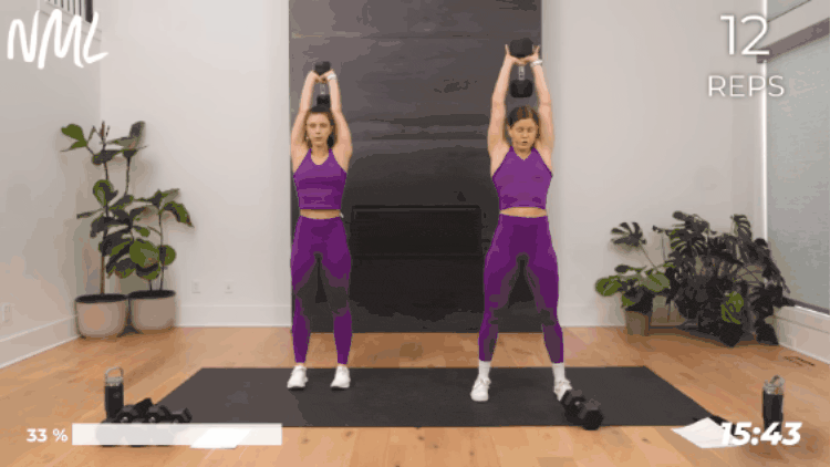 women in purple workout outfits performing an overhead tricep extension as part of full body workout