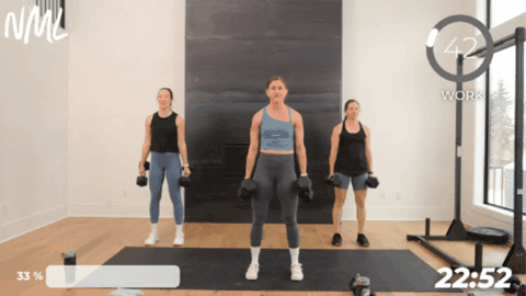 women performing dumbbell squats to prepare for marine fitness test