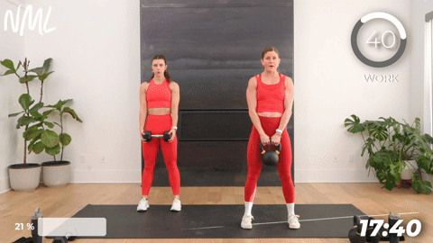 two women performing deadlifts in a 20 minute kettlebell workout