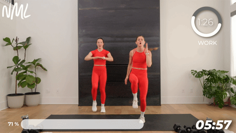 two women performing 3 count high knees in a walking workout at home