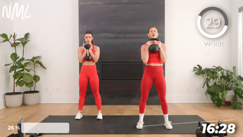 two women performing goblet squats in a 20 minute kettlebell workout