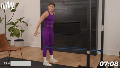 woman performing spanish squats as part of knee mobility exercises to build strength and stability