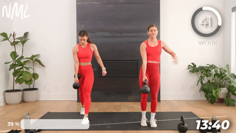 two women performing reverse lunges in a 20 minute kettlebell workout