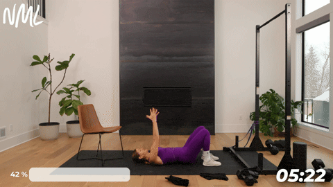 woman performing glute bridges as part of knee mobility exercises to build strength and stability