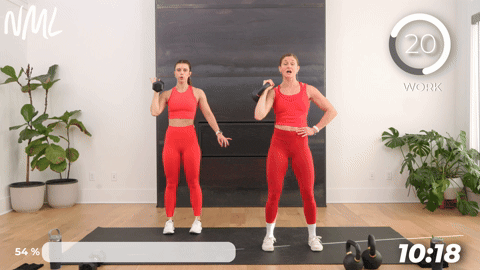 two women performing single arm presses in a 20 minute kettlebell workout