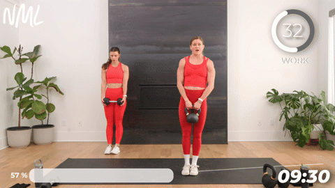 two women performing lateral lunges in a 20 minute kettlebell workout