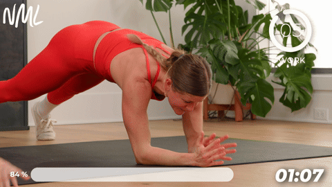 two women performing plank arm extensions in a quick ab workout