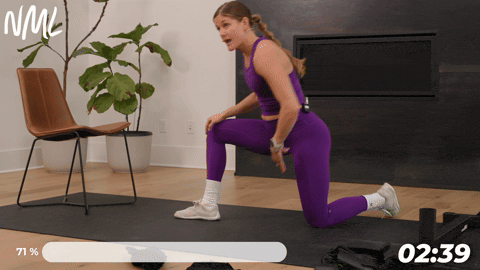 woman performing ankle mobility rocks as part of knee mobility exercises