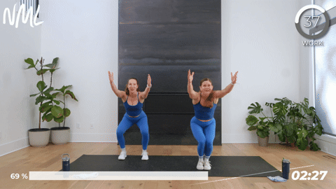 two women performing an isometric chair squat hold in a 10 minute hiit workout