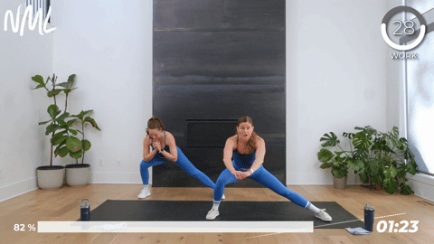 two women performing a lateral squat hold in a 10 minute hiit workout