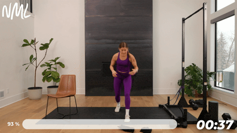woman performing a reverse lunge isometric hold as part of knee mobility exercises to build strength and stability