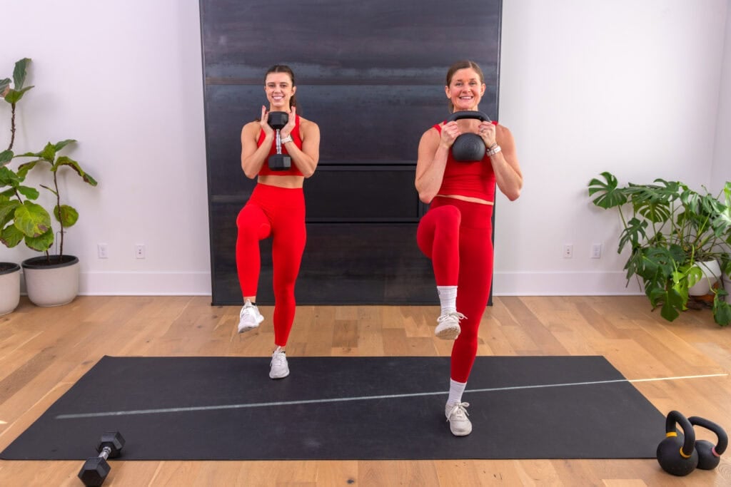 two women performing goblet marches in a 20 minute kettlebell workout