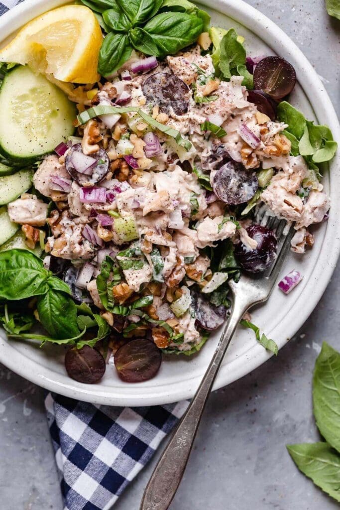 Waldorf chicken Salad with chicken salad, mixed greens, grapes, onions, walnuts, shredded chicken and homemade dressing.