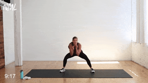 A woman working out doing bob and weaves