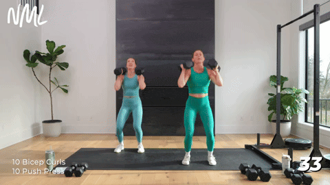 Two women doing push pressses