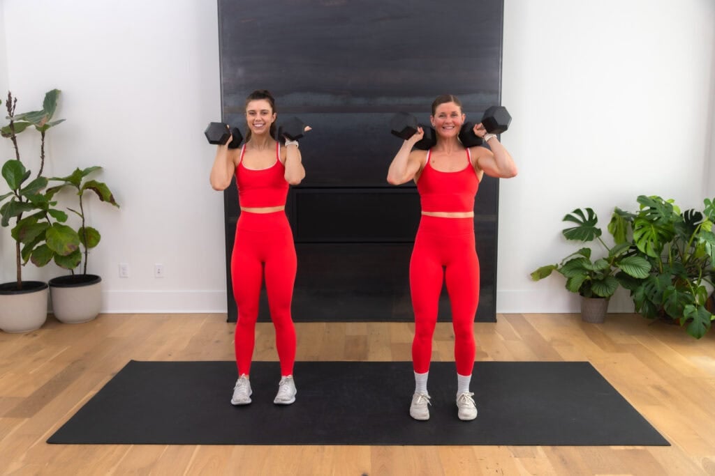 Two women working out with dumbbells