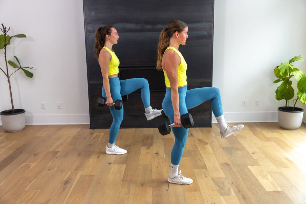 two women doing alternated weighted leg lifts
