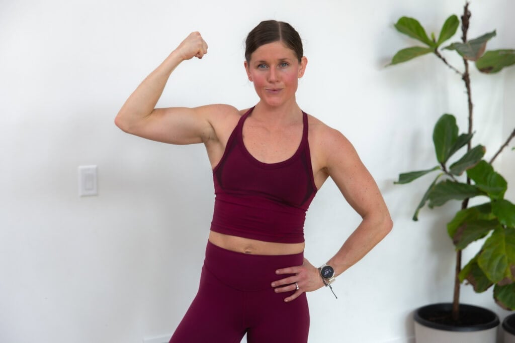 A woman doing a strong pose.